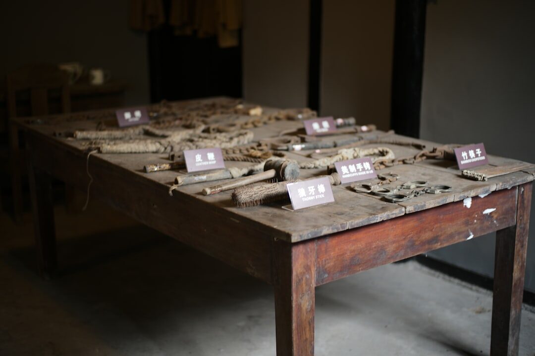 Vintage film reels and celluloid strips arranged on a wooden archive table