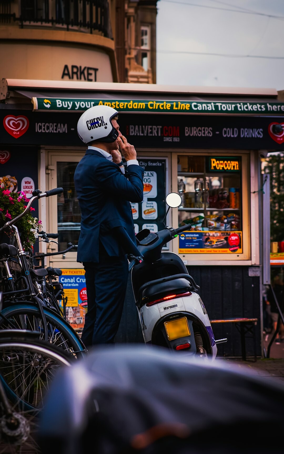 Portrait of a Dutch male jazz musician in a tailored suit holding a trumpet